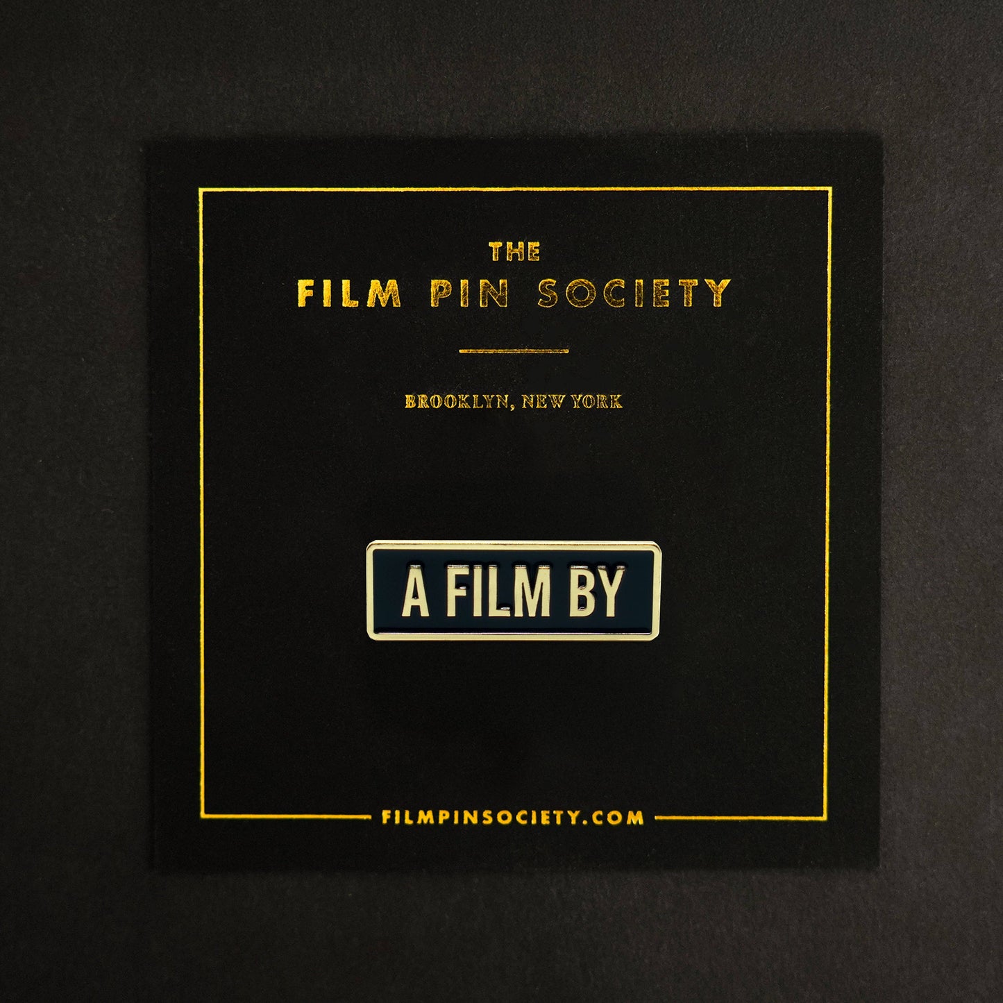 A Film by Credit Enamel Pin