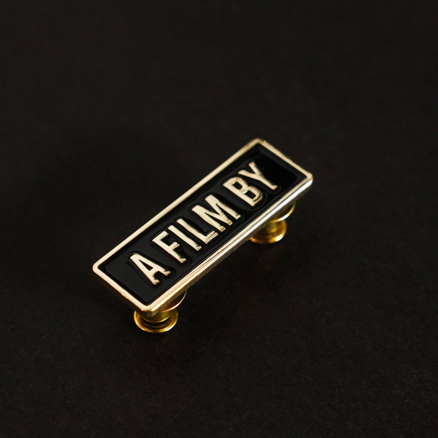 A Film by Credit Enamel Pin